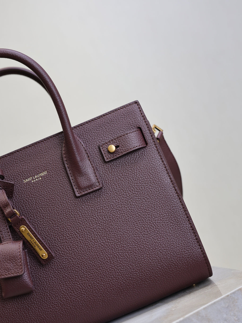 YSL 25S SAC DE JOUR MM 26 IN ROUGE CABERNET SUPPLE GRAINED CALFSKIN