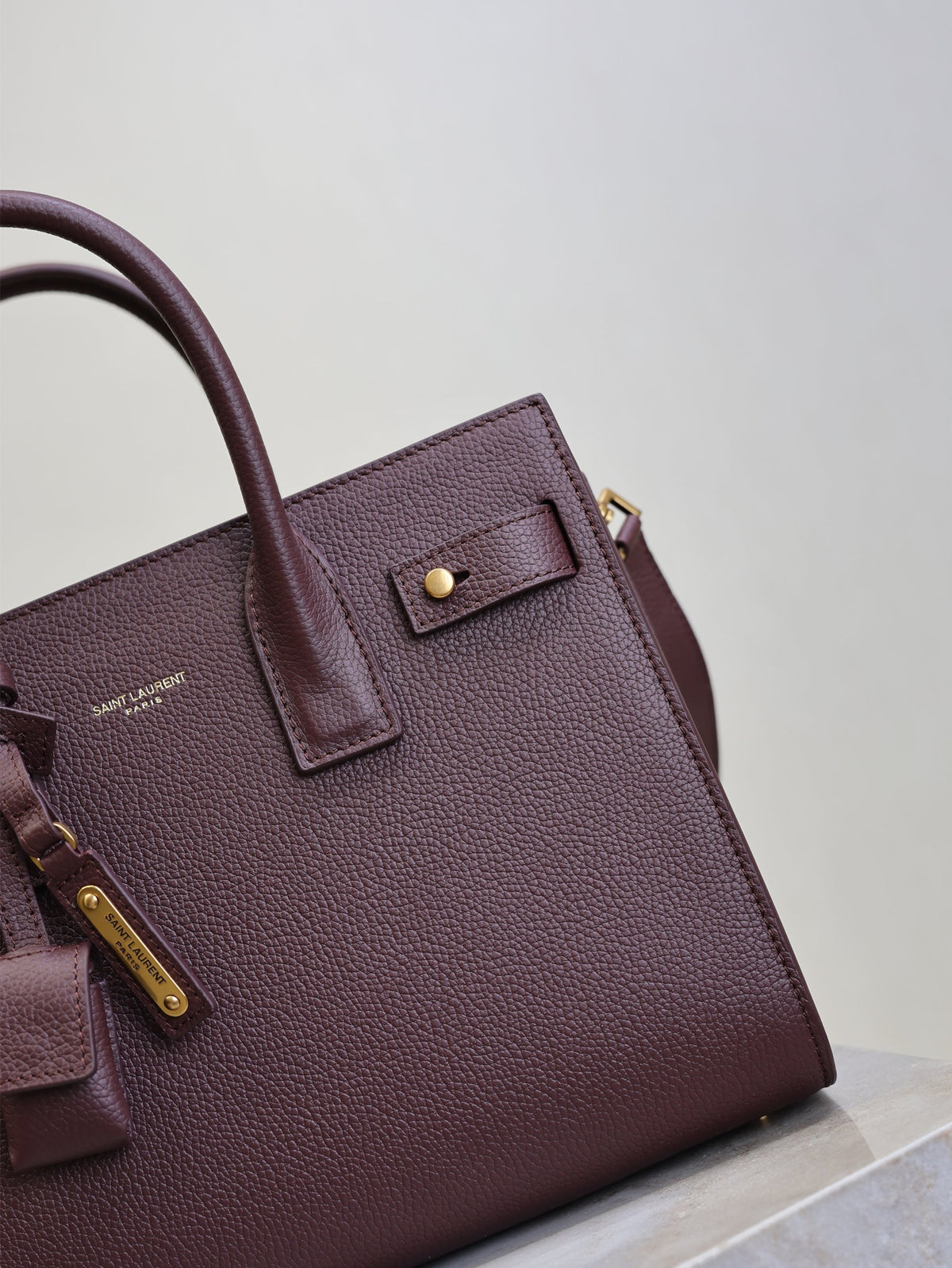 YSL 25S SAC DE JOUR MM 26 IN ROUGE CABERNET SUPPLE GRAINED CALFSKIN