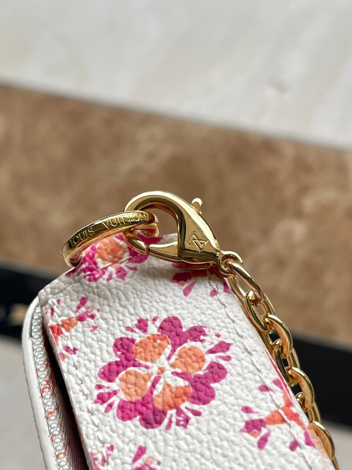 LOUIS VUITTON FÉLICIE POCHETTE 21 IN CORAL MONOGRAM TILES CANVAS
